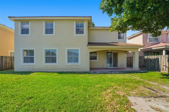a backyard of a house with lots of green space