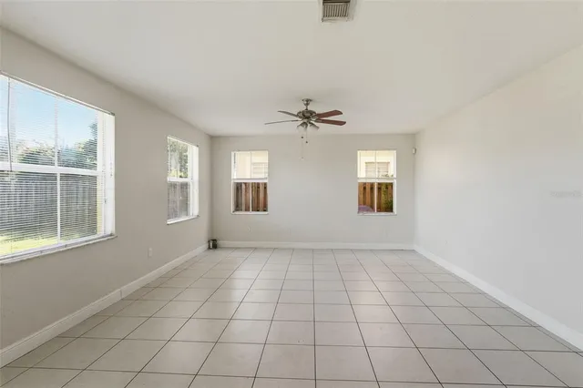 a kitchen with granite countertop a refrigerator and a stove