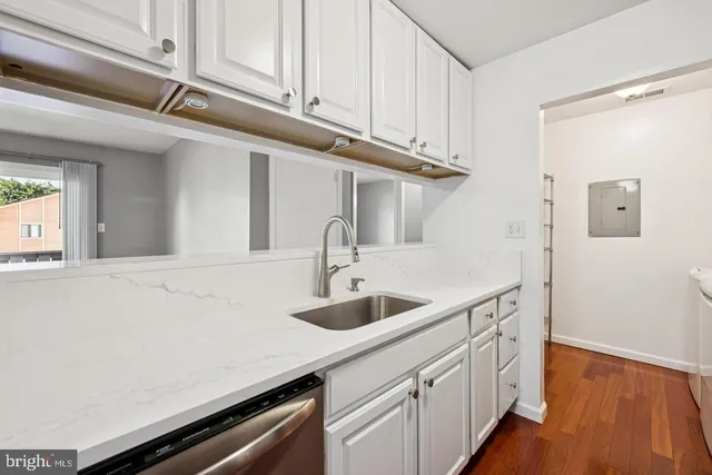 a kitchen with a sink and cabinets