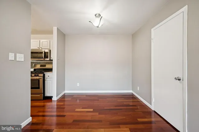 a view of kitchen and wooden floor