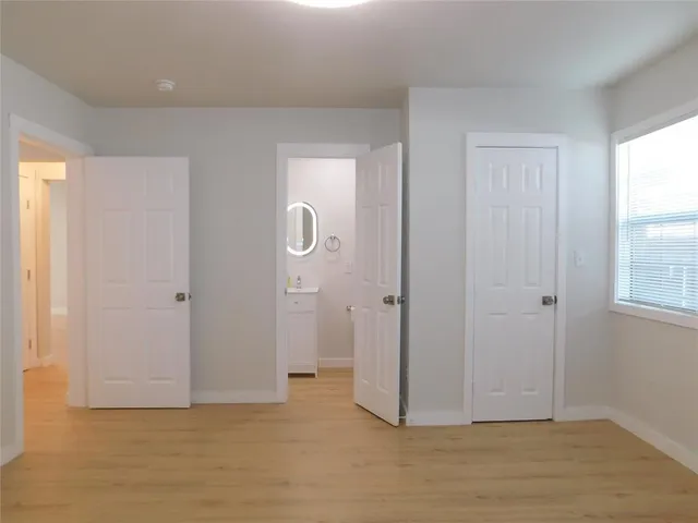 a bathroom with a sink a mirror and shower