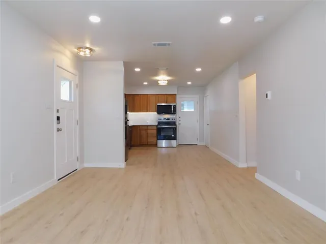a kitchen with a refrigerator and a sink