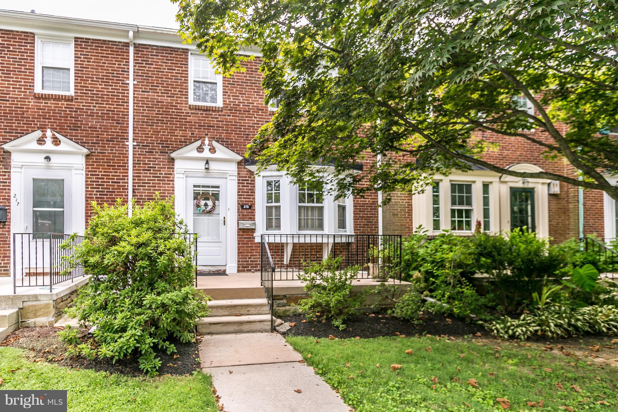 215 Dumbarton Road Baltimore, MD 21212 - Photo 1 of 30 a front view of a house with a garden