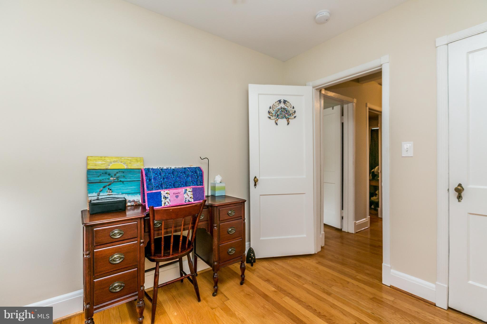 215 Dumbarton Road Baltimore, MD 21212 - Photo 13 of 30 a view of a workspace with furniture and wooden floor