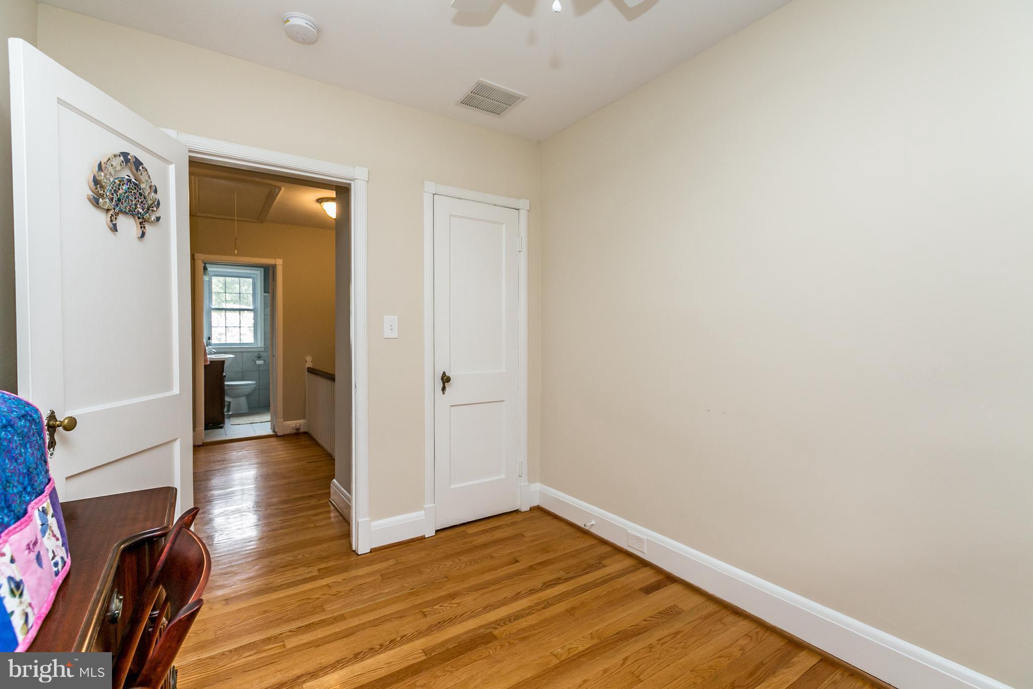 215 Dumbarton Road Baltimore, MD 21212 - Photo 14 of 30 a view of a hallway with wooden floor