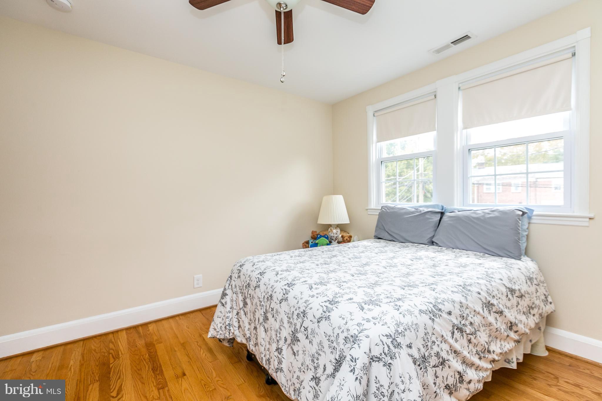 215 Dumbarton Road Baltimore, MD 21212 - Photo 16 of 30 a bed sitting in a bedroom next to a window