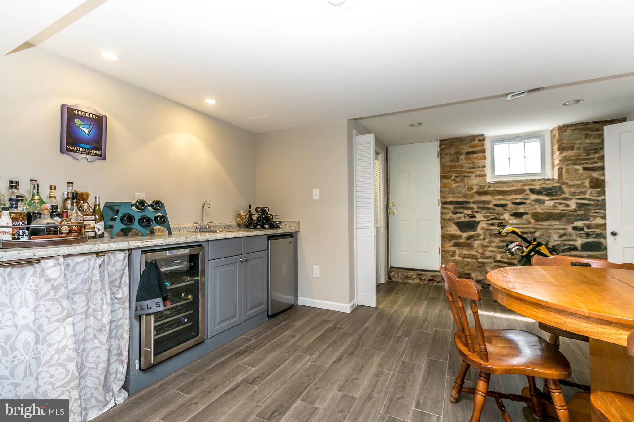 215 Dumbarton Road Baltimore, MD 21212 - Photo 25 of 30 a view of a kitchen with furniture and wooden floor