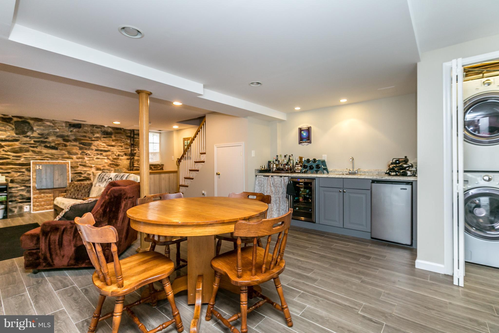 215 Dumbarton Road Baltimore, MD 21212 - Photo 26 of 30 a kitchen with a table and chairs