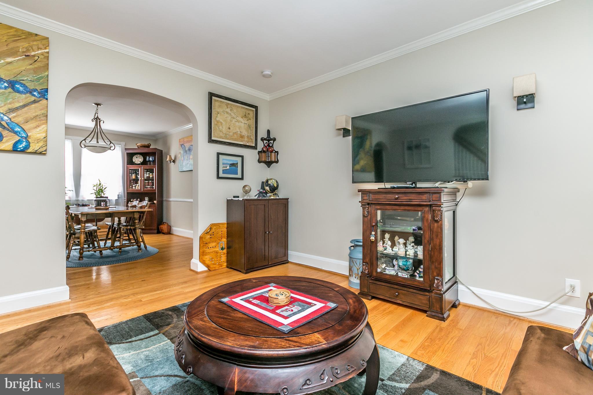 215 Dumbarton Road Baltimore, MD 21212 - Photo 5 of 30 a living room with furniture and a fireplace