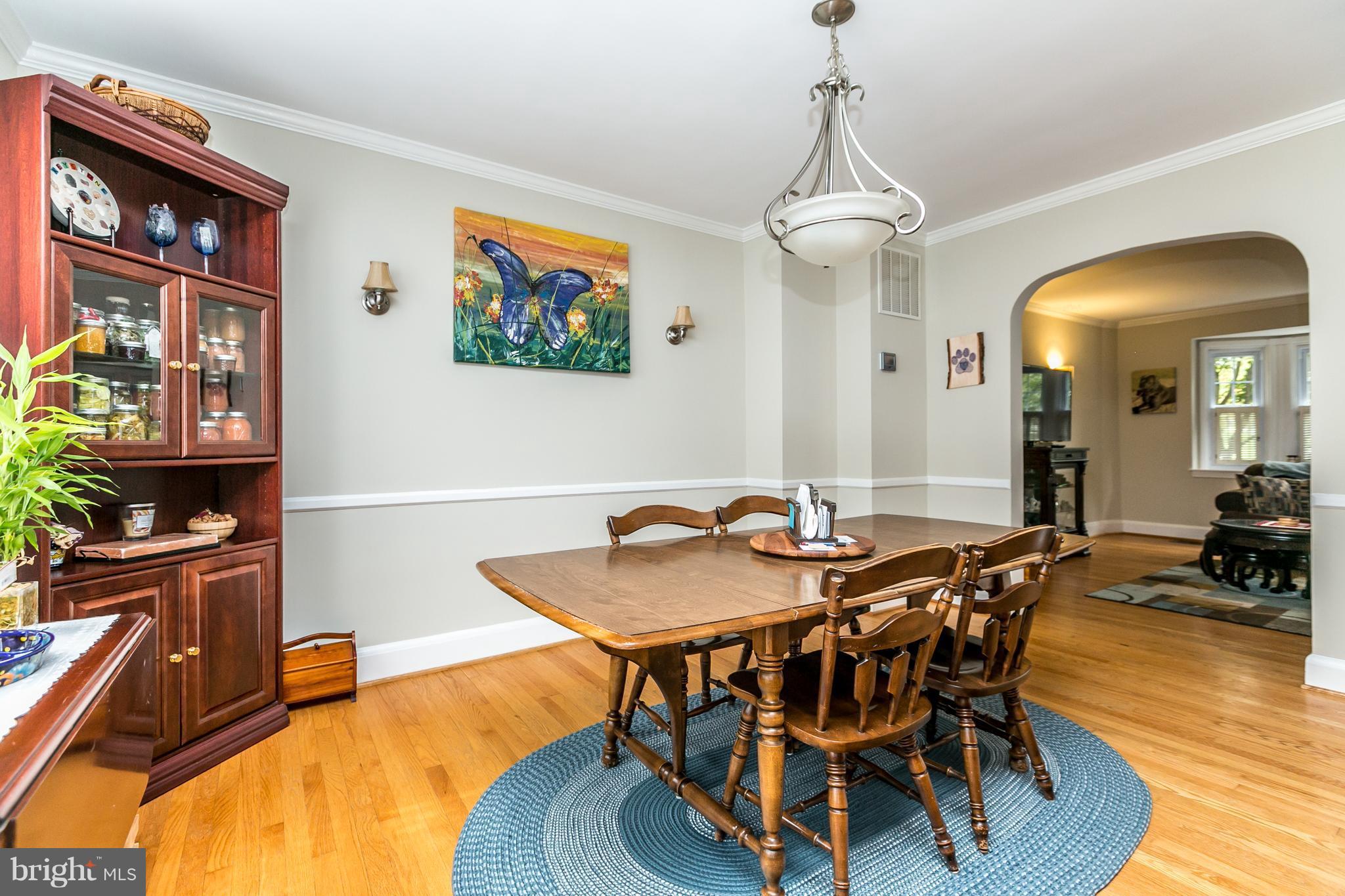 215 Dumbarton Road Baltimore, MD 21212 - Photo 7 of 30 a view of a dining room with furniture and wooden floor