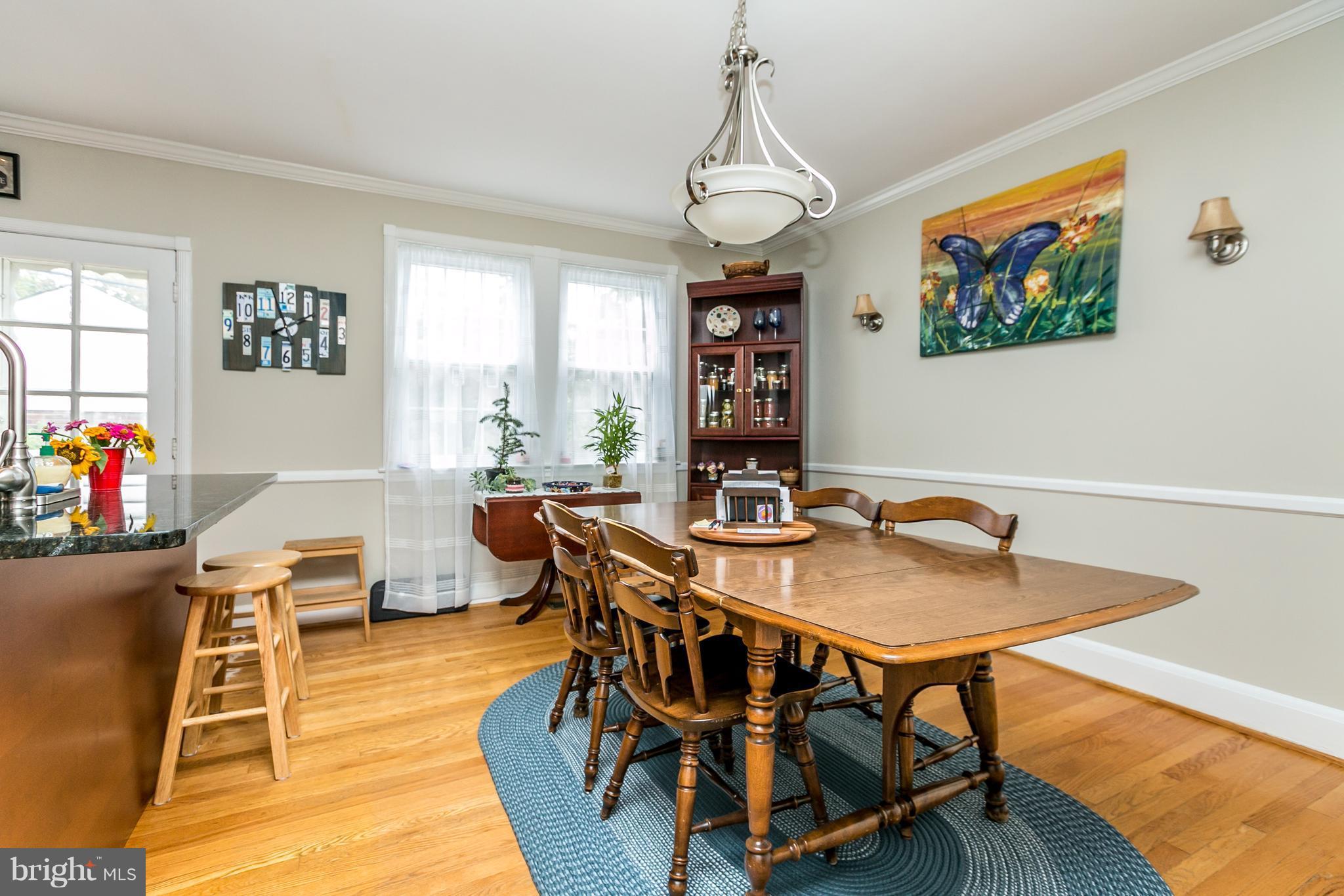 215 Dumbarton Road Baltimore, MD 21212 - Photo 8 of 30 a view of a dining room with furniture window and wooden floor