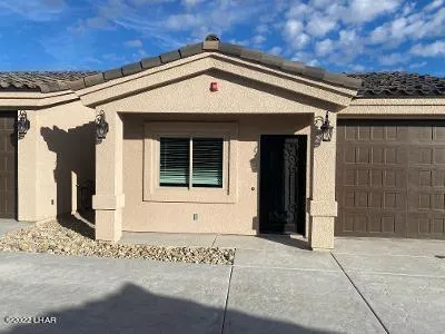 a front view of a house with a book garage