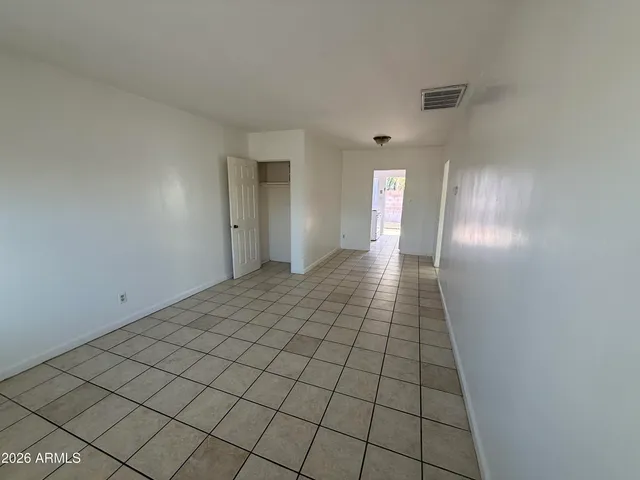 a view of an empty room and window
