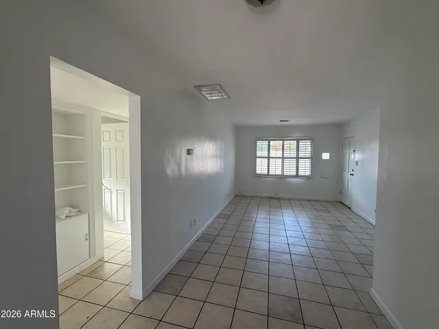 a view of an empty room and window