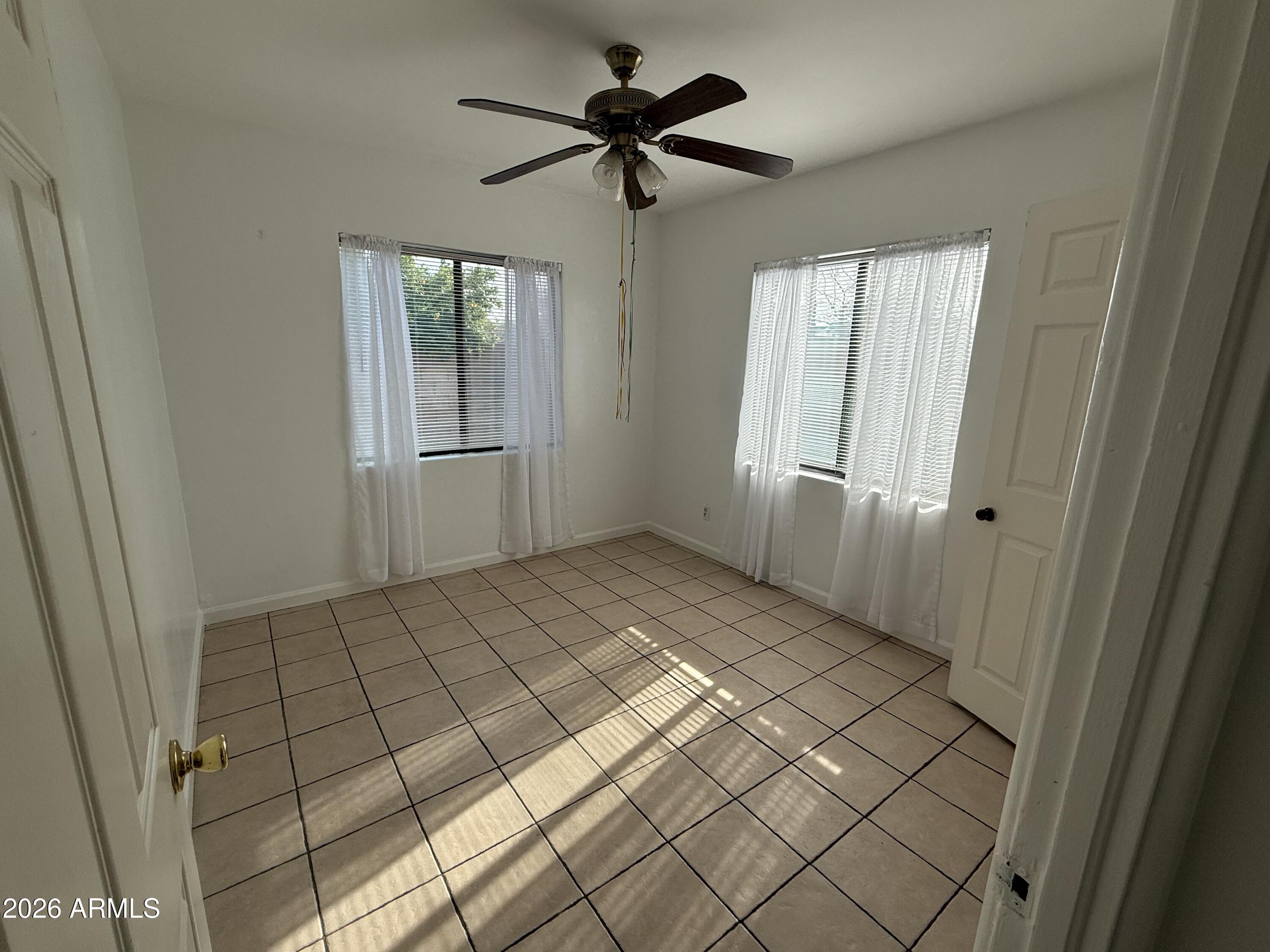 1801 North 7th Avenue Phoenix, AZ 85003 - Photo 6 of 14 a view of an empty room and window