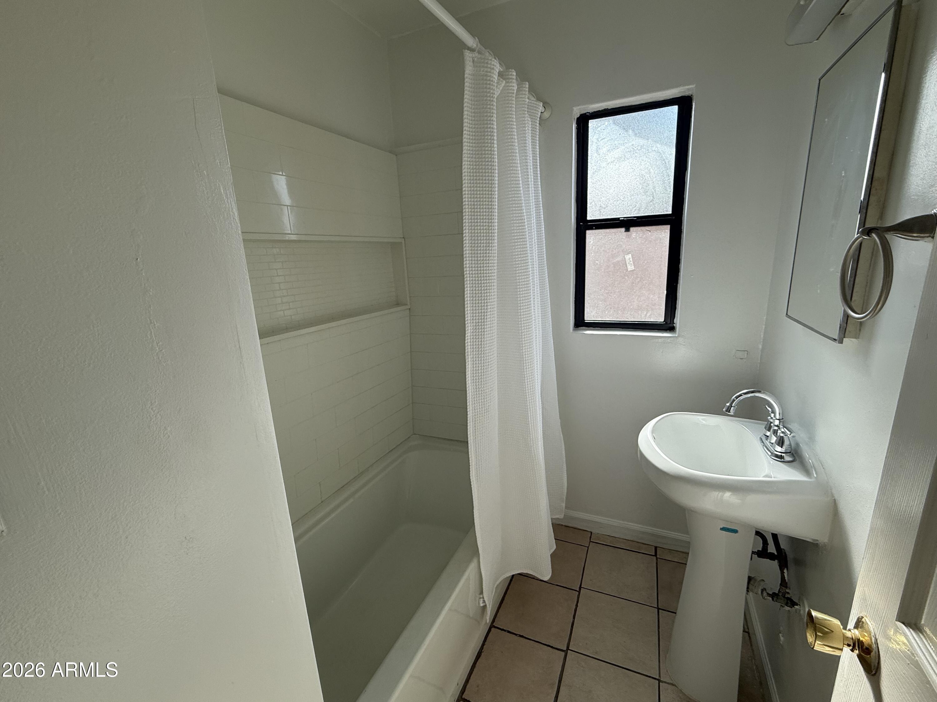1801 North 7th Avenue Phoenix, AZ 85003 - Photo 9 of 14 a bathroom with a sink toilet and shower