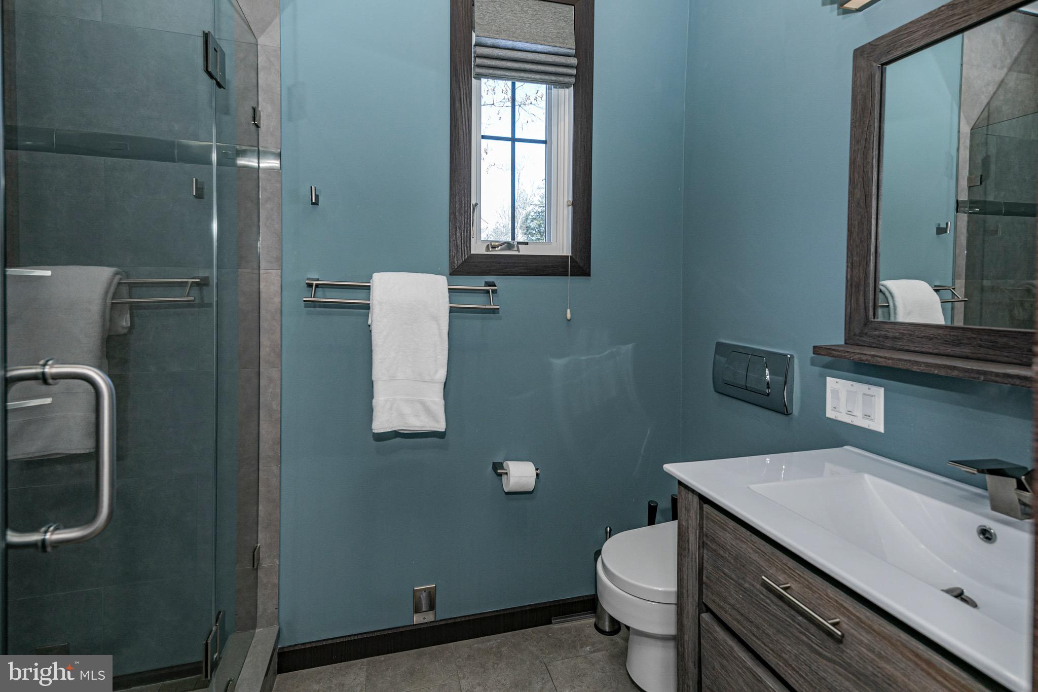 31 Westerly Road Princeton, NJ 08540 - Photo 31 of 47 a bathroom with a granite countertop toilet sink and mirror