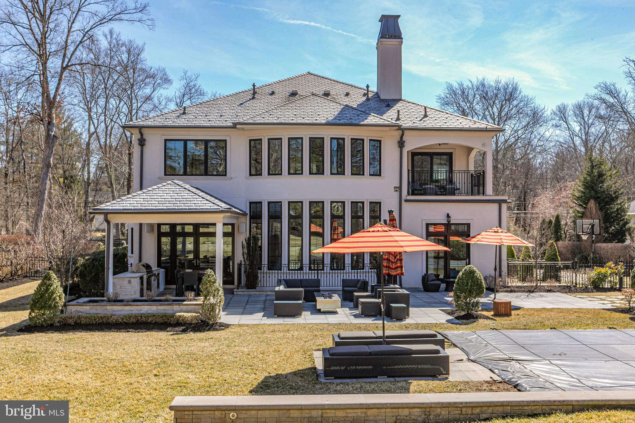31 Westerly Road Princeton, NJ 08540 - Photo 41 of 47 a patio with a table and chairs under an umbrella