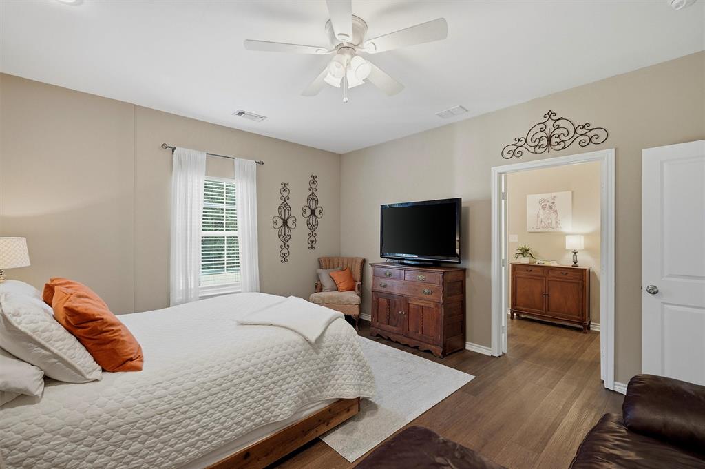 15656 South State Highway 78 Blue Ridge, TX 75424 - Photo 19 of 36 a bedroom with a bed and a flat screen tv