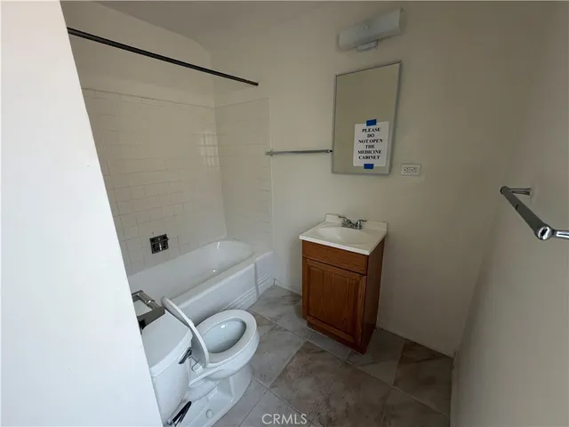 a bathroom with a toilet a sink and a shower