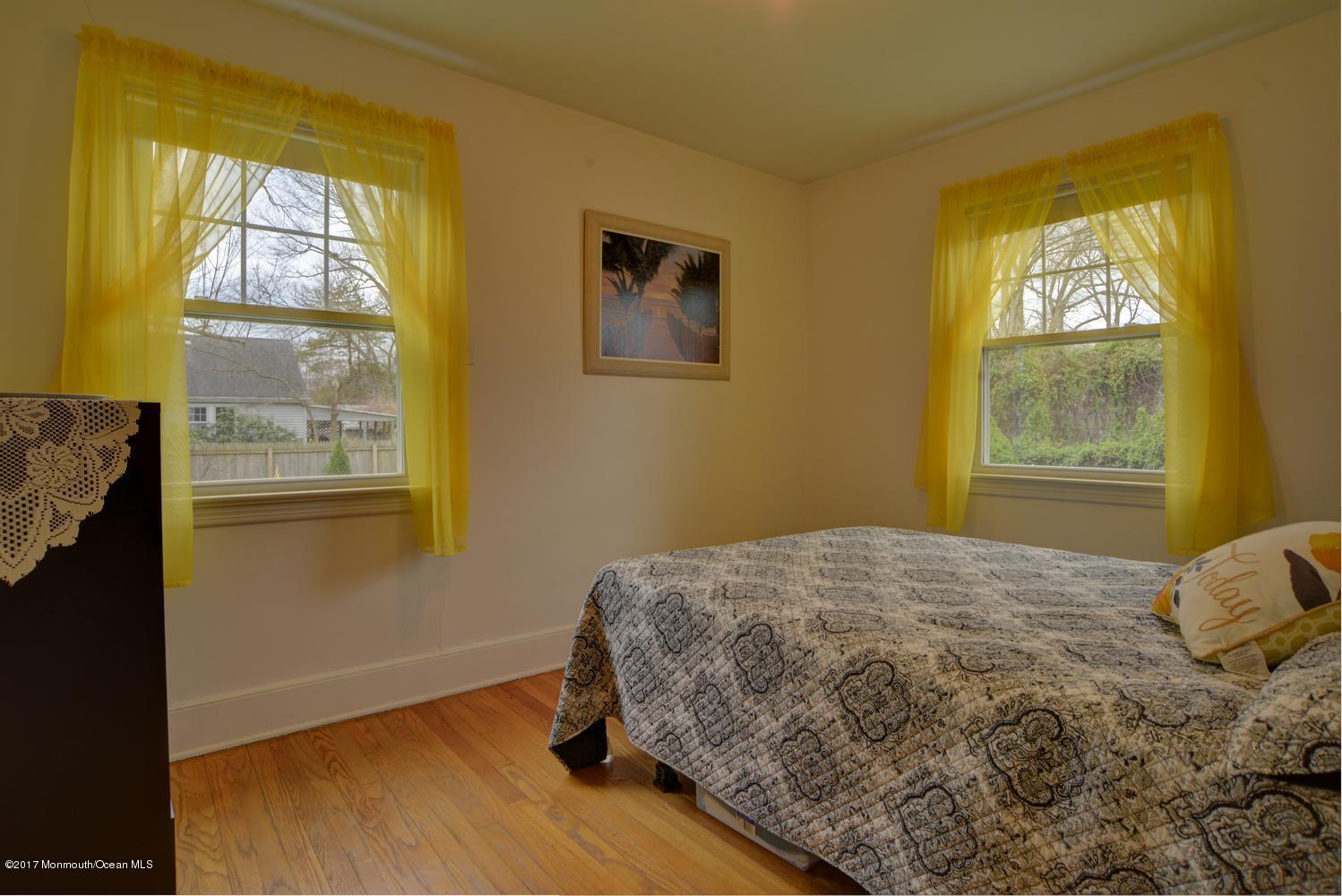 123 Robin Road Neptune Township, NJ 07753 - Photo 13 of 28 a bedroom with a bed and a window
