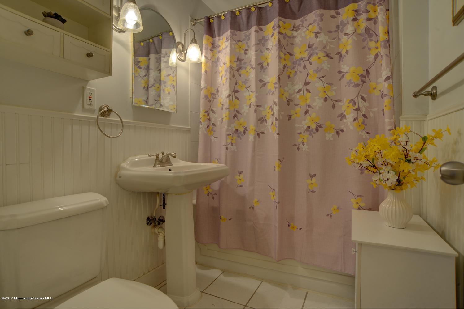123 Robin Road Neptune Township, NJ 07753 - Photo 15 of 28 a bathroom with a sink toilet and shower
