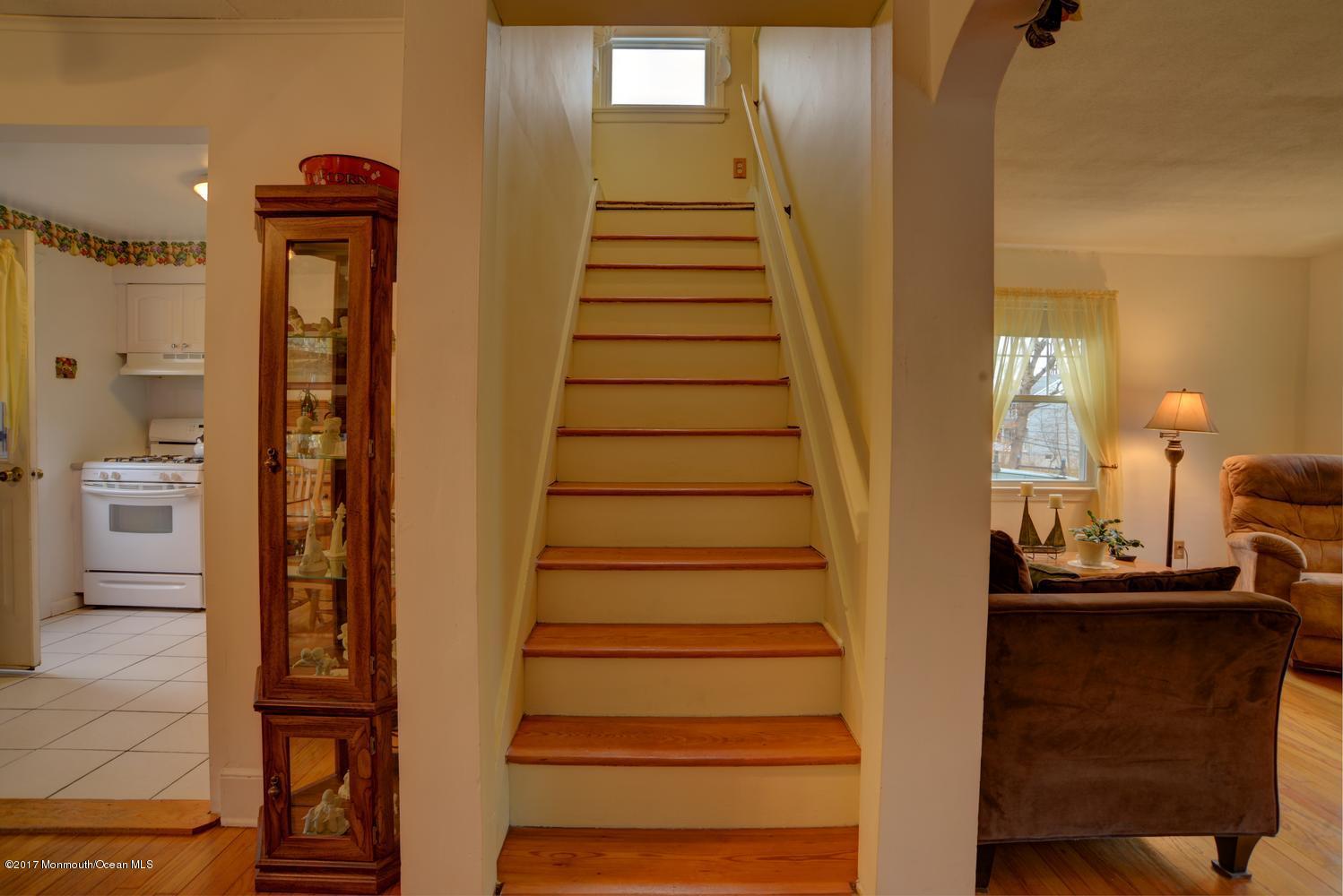 123 Robin Road Neptune Township, NJ 07753 - Photo 16 of 28 a view of entryway and hall with wooden floor