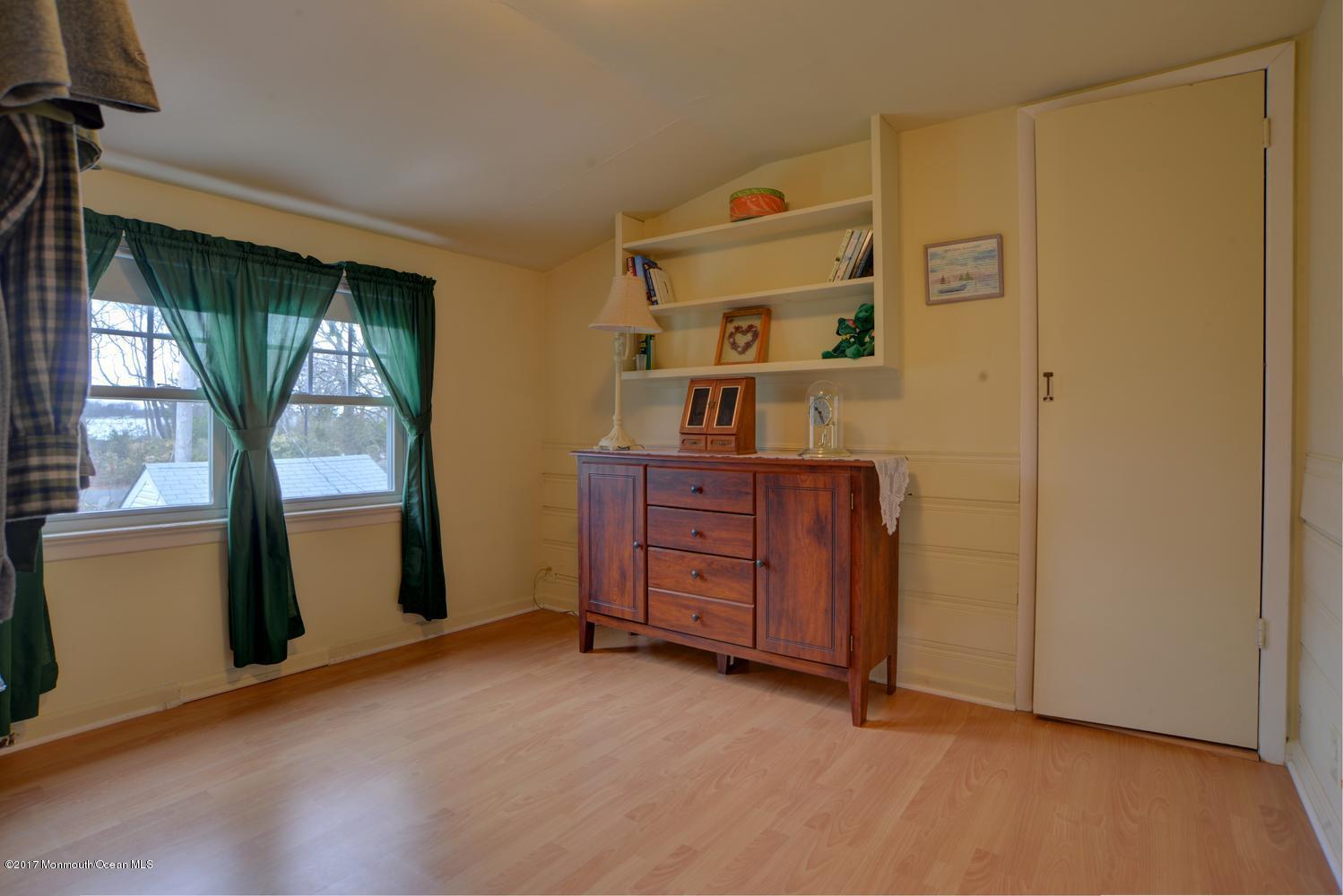 123 Robin Road Neptune Township, NJ 07753 - Photo 18 of 28 a view of an empty room with a window