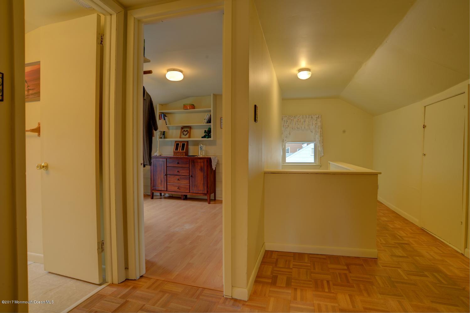 123 Robin Road Neptune Township, NJ 07753 - Photo 23 of 28 a view of a hallway with wooden floor
