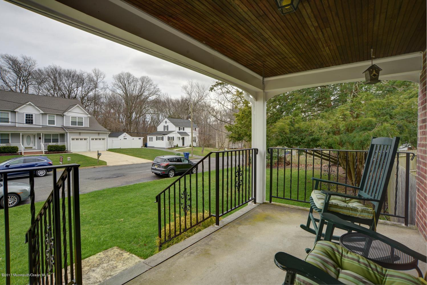 123 Robin Road Neptune Township, NJ 07753 - Photo 5 of 28 a view of a porch with furniture and garden