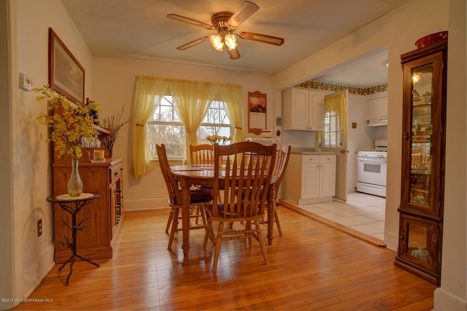 123 Robin Road Neptune Township, NJ 07753 - Photo 8 of 28 a view of a dining room with furniture and wooden floor