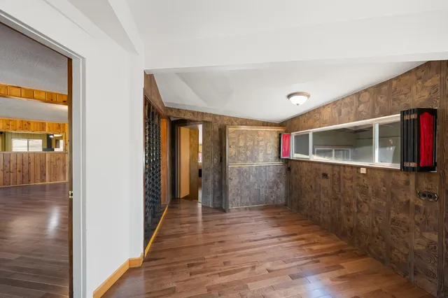 a view of a bedroom with furniture and windows