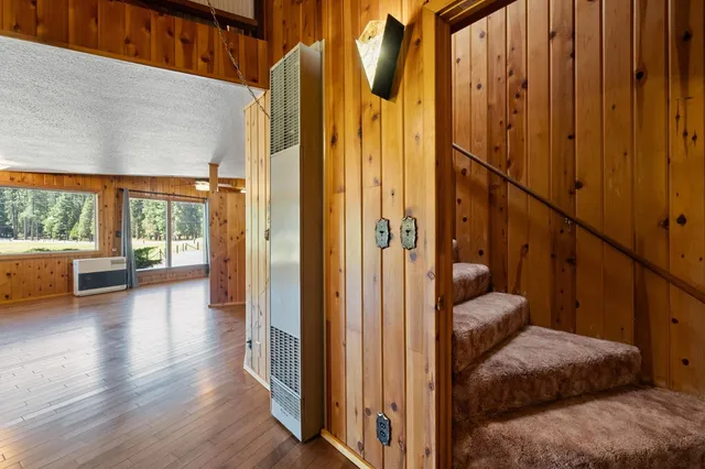 a kitchen with stainless steel appliances granite countertop a refrigerator and a stove