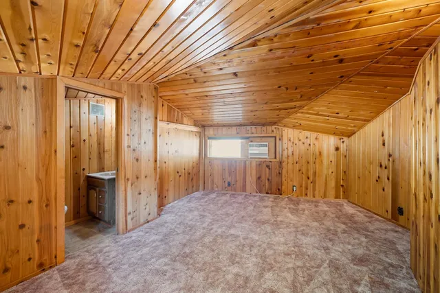 a bathroom with a shower and a sink