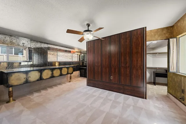 a view of storage and utility room with racks on the wall