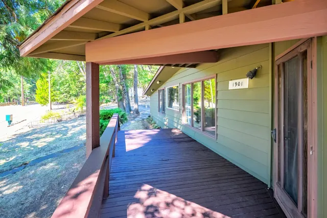 a view of a swimming pool with a ocean from a balcony