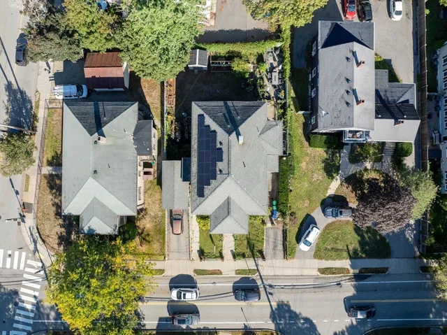 an aerial view of houses with outdoor space