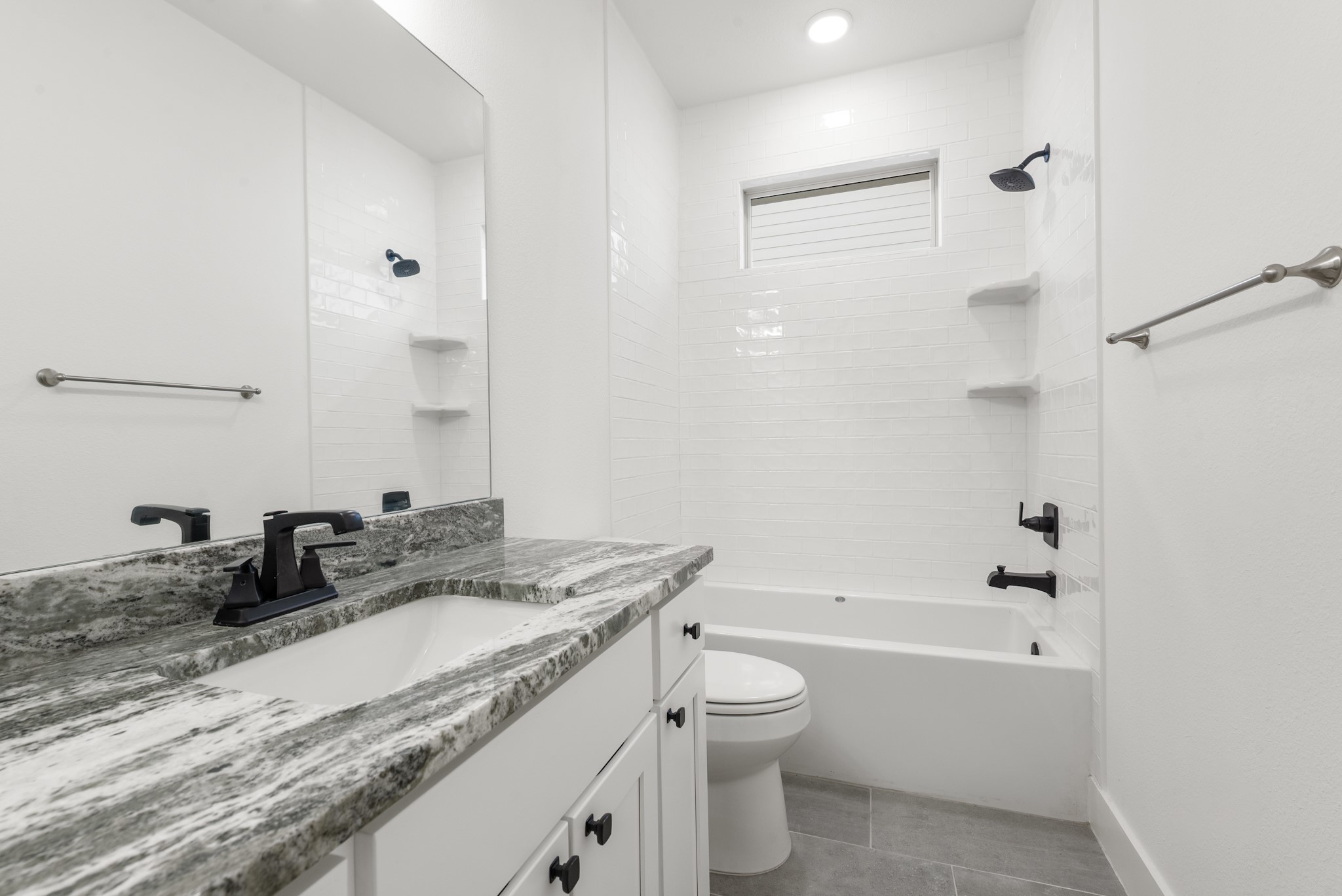 424 Brazos Bend Snook, TX 77879 - Photo 17 of 23 a bathroom with a granite countertop sink a toilet a mirror and shower