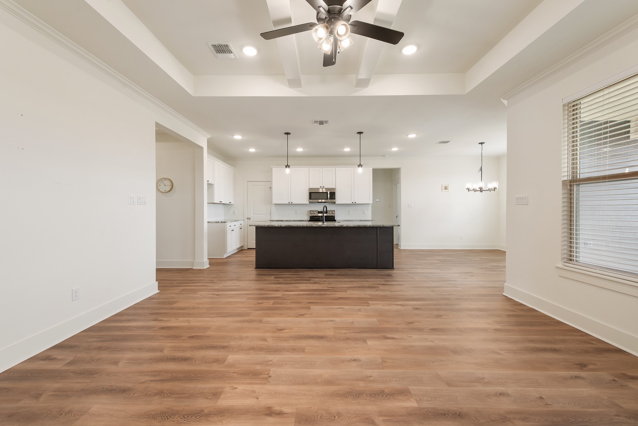 424 Brazos Bend Snook, TX 77879 - Photo 4 of 23 a view of kitchen with kitchen island white cabinets and stainless steel appliances