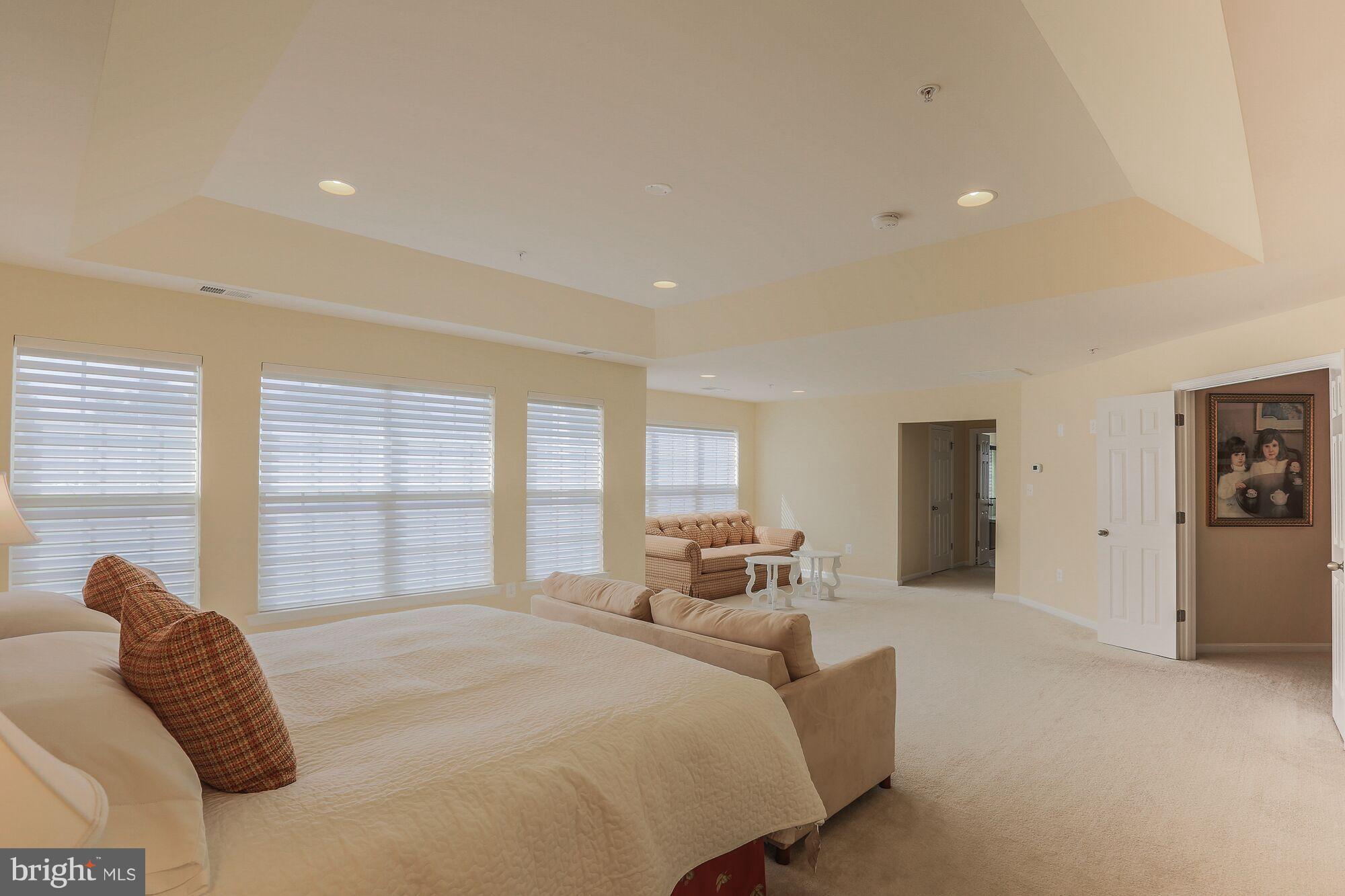 6524 Pebble Brooke Road Baltimore, MD 21209 - Photo 12 of 20 a bed room with a bed and a large window