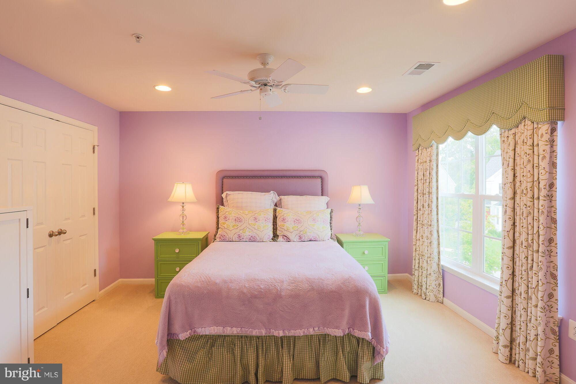 6524 Pebble Brooke Road Baltimore, MD 21209 - Photo 17 of 20 a bedroom with a bed and a window