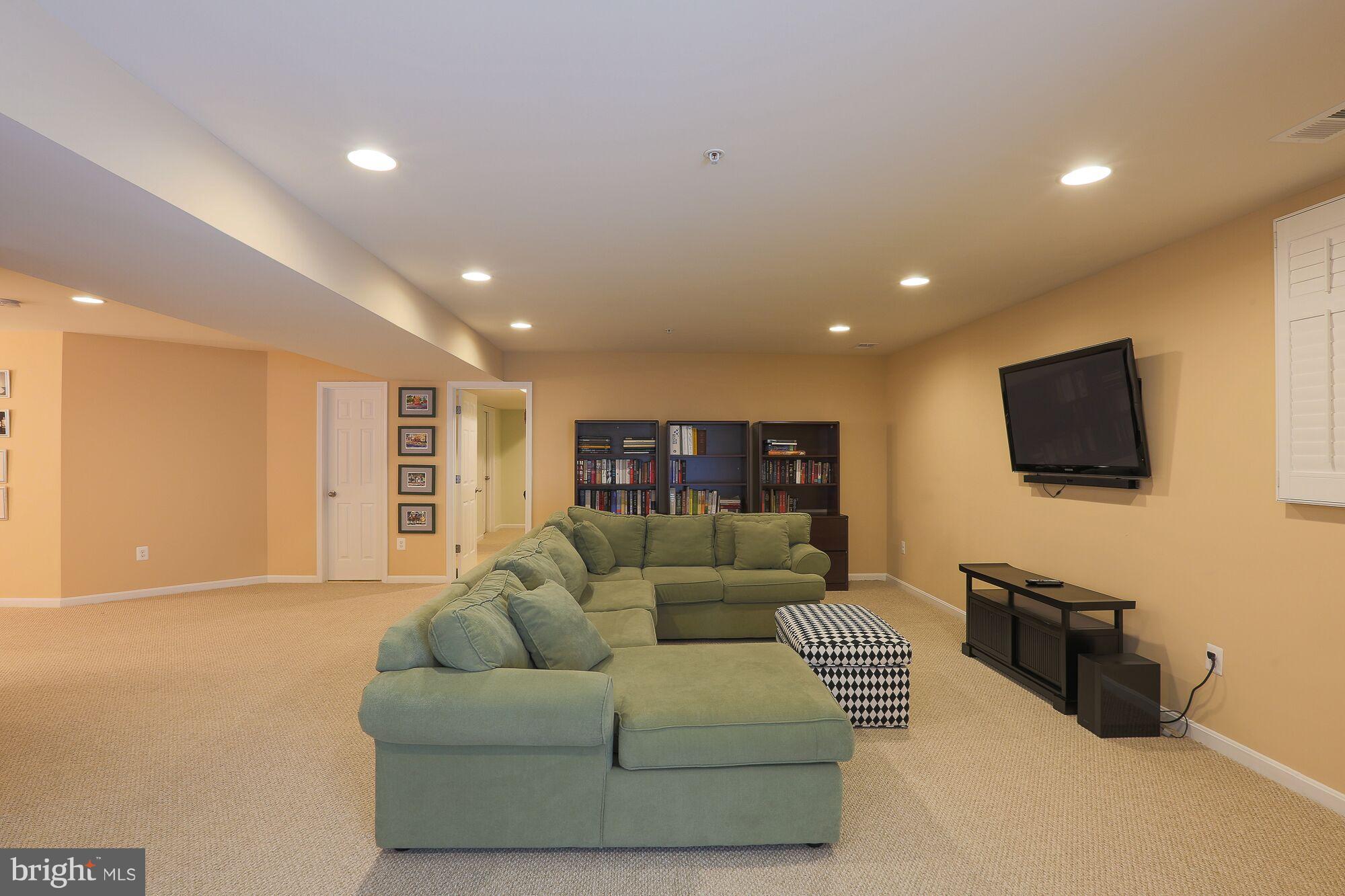 6524 Pebble Brooke Road Baltimore, MD 21209 - Photo 20 of 20 a living room with furniture and a flat screen tv