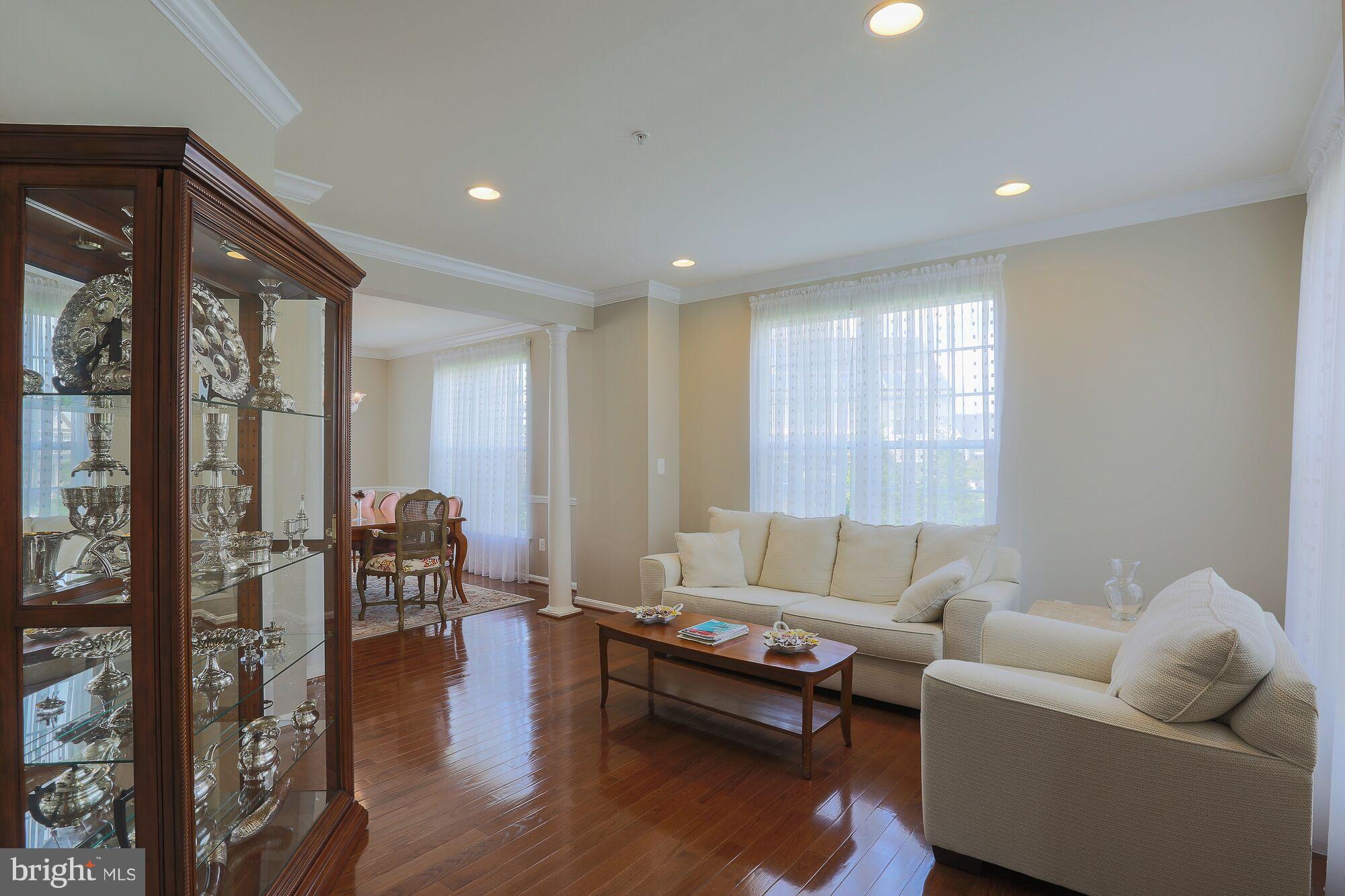 6524 Pebble Brooke Road Baltimore, MD 21209 - Photo 4 of 20 a living room with furniture and a wooden floor