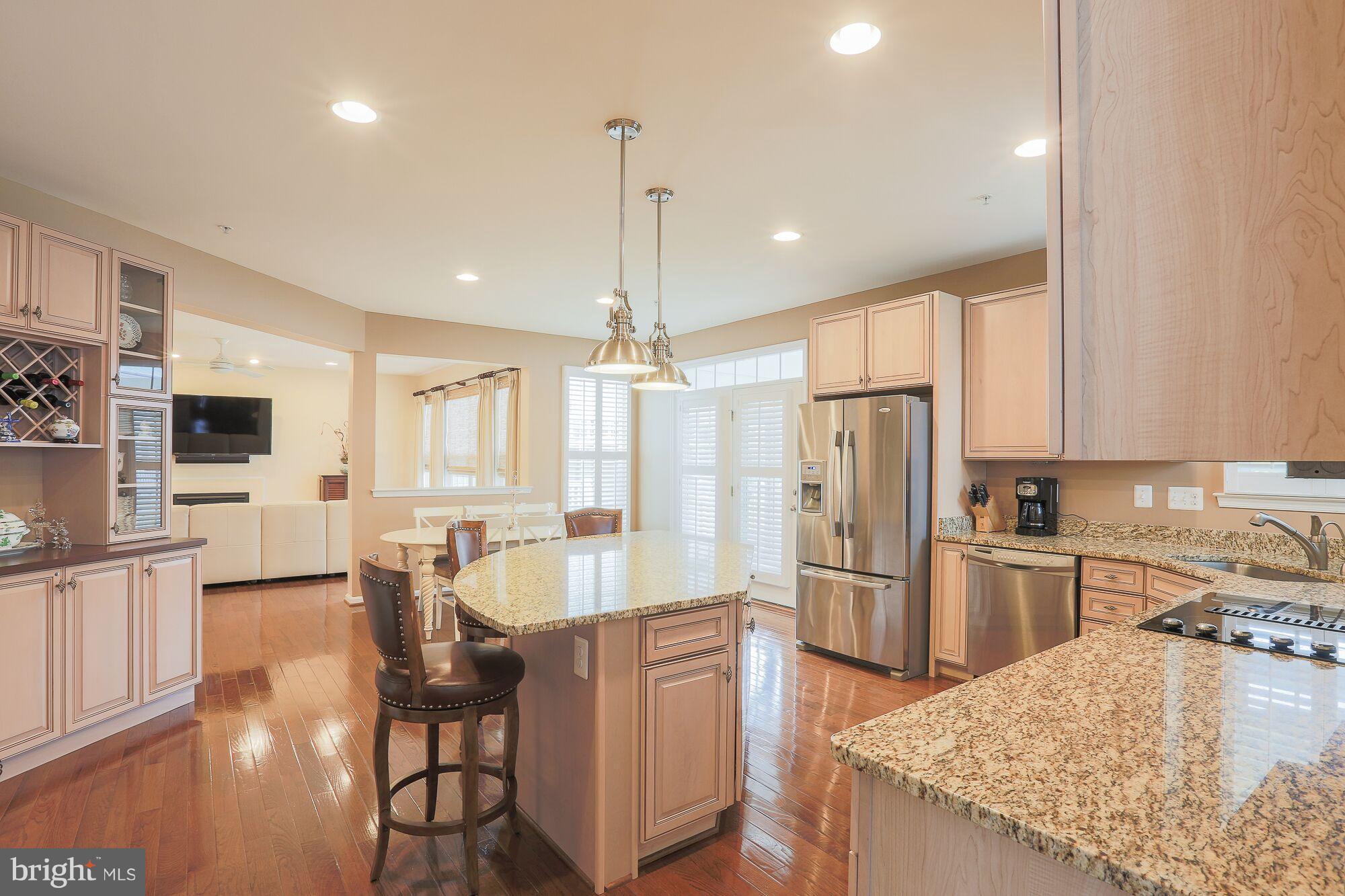 6524 Pebble Brooke Road Baltimore, MD 21209 - Photo 6 of 20 a kitchen with refrigerator cabinets and a counter top space