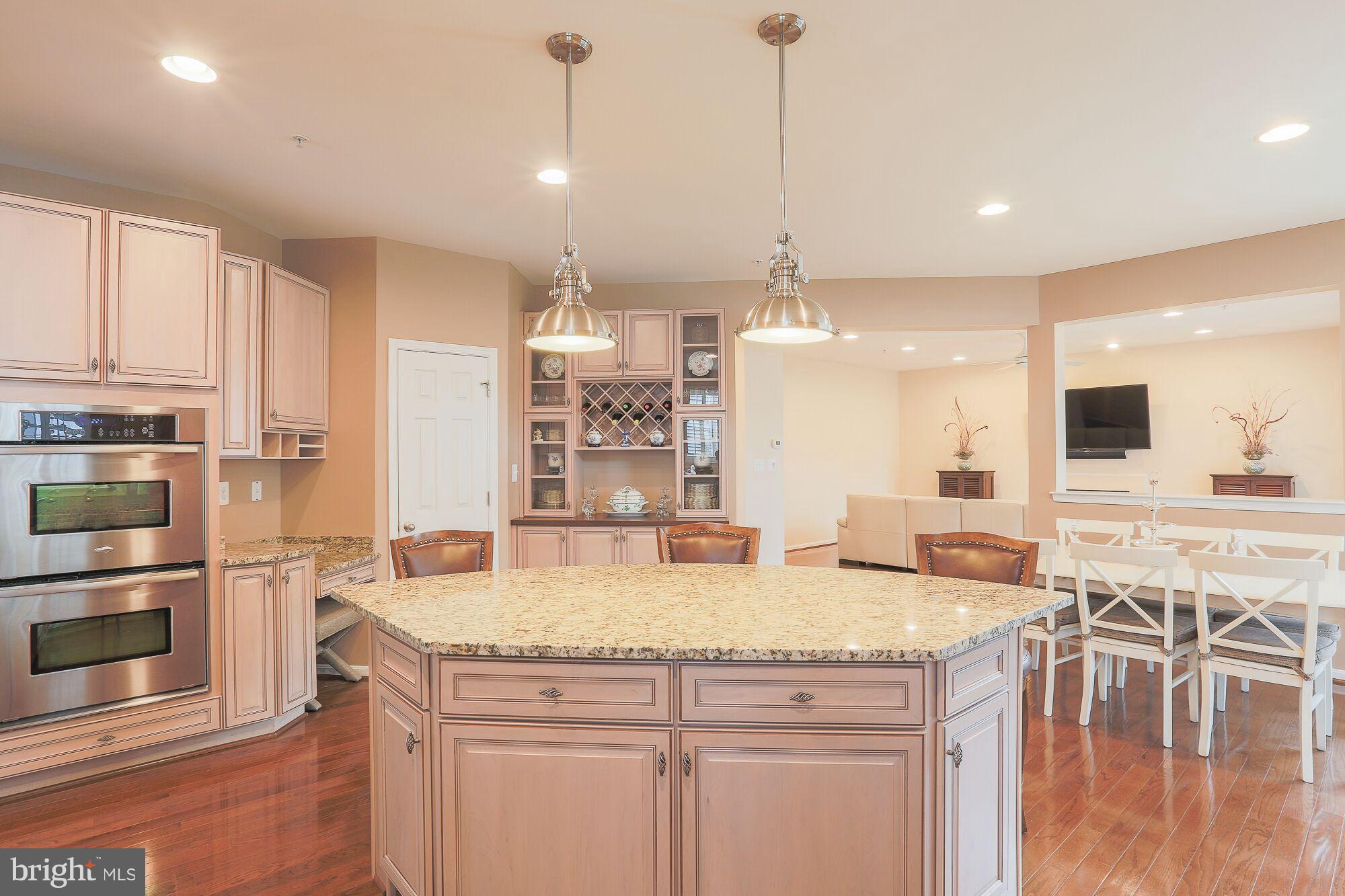 6524 Pebble Brooke Road Baltimore, MD 21209 - Photo 7 of 20 a kitchen with stainless steel appliances granite countertop a stove and refrigerator