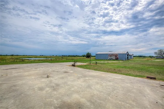 a view of yard with swimming pool