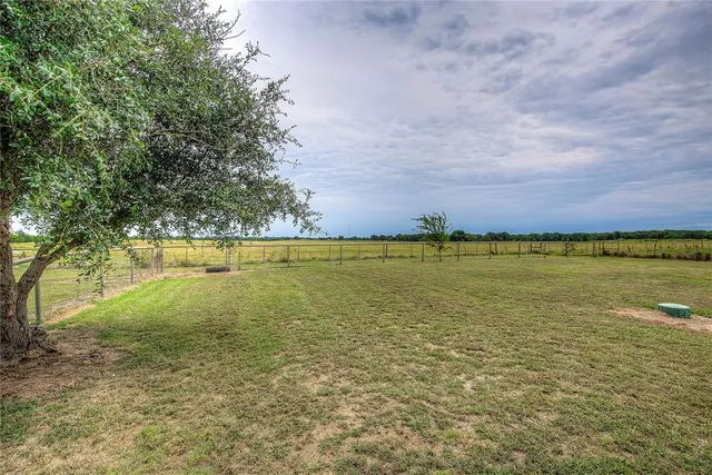a view of a swimming pool and an outdoor seating