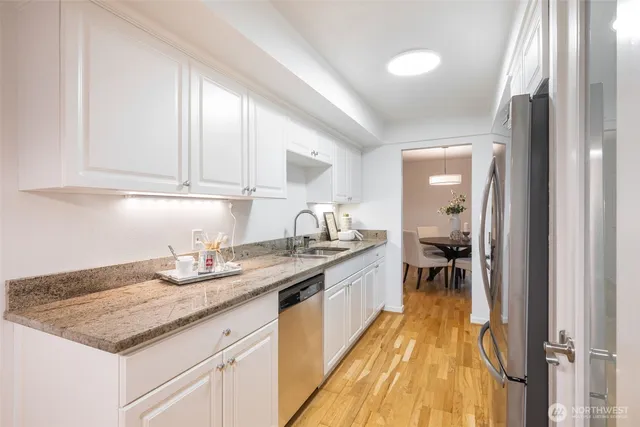 a kitchen with a sink and cabinets