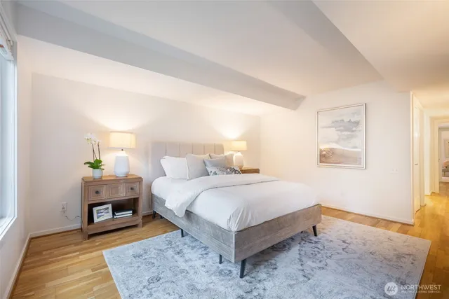 a bedroom with a bed and a couch