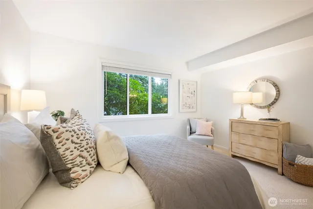 a bedroom with a bed and window